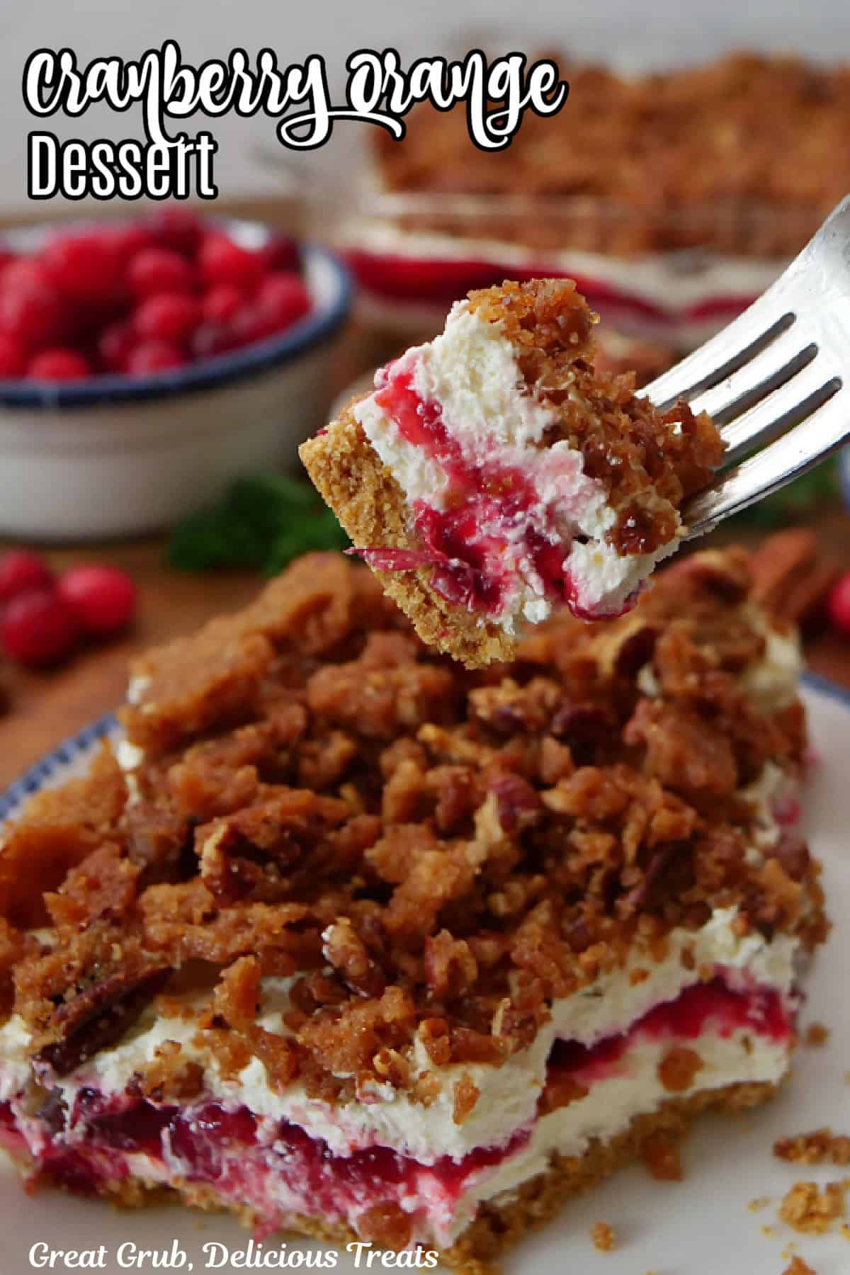 A fork with a bite of cream cheese cranberry orange dessert on it.