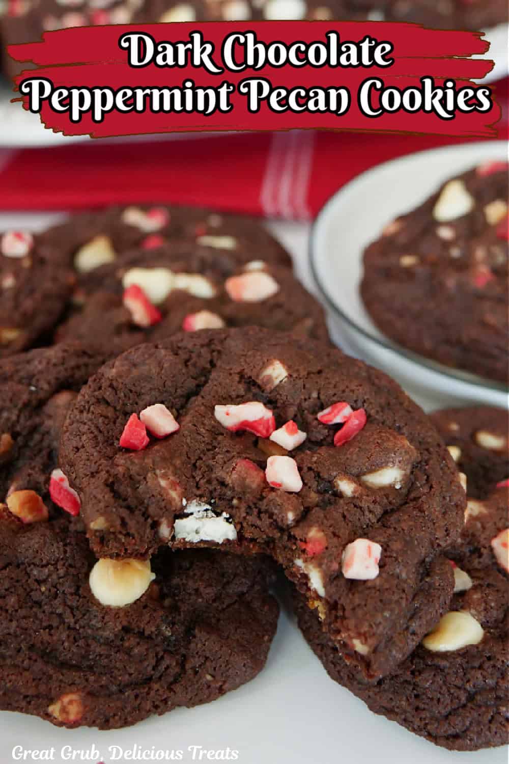 Chocolate peppermint cookies on a counter with a bite taken out of the cookie in front.