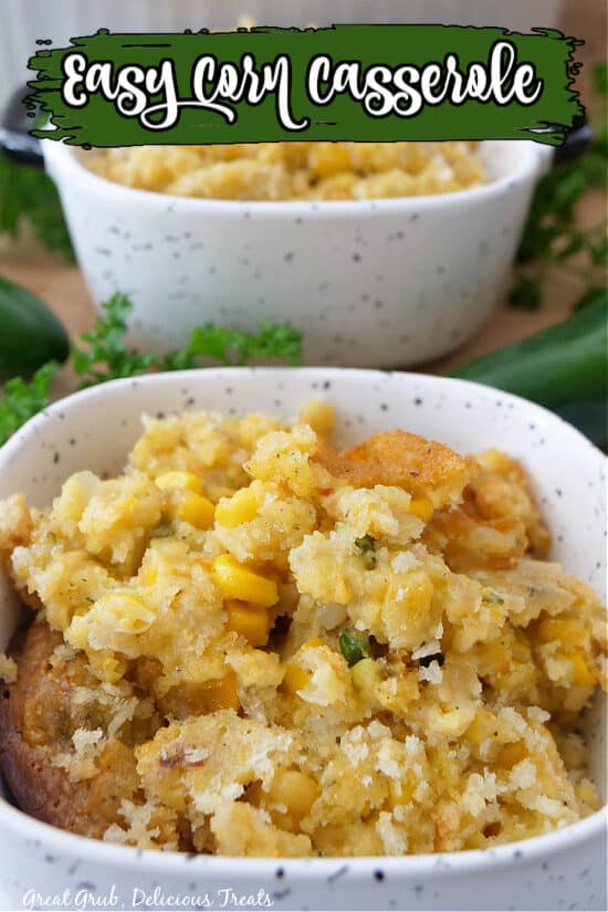 Corn casserole in a white speckled baking dish with the title at the top.