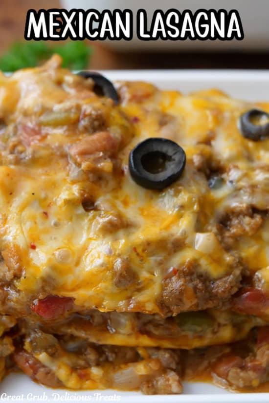 A close up of a serving of Mexican Lasagna on a white plate.
