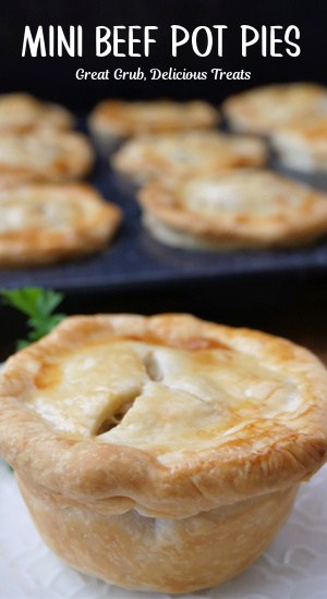 A mini beef pot pie on a small white plate.