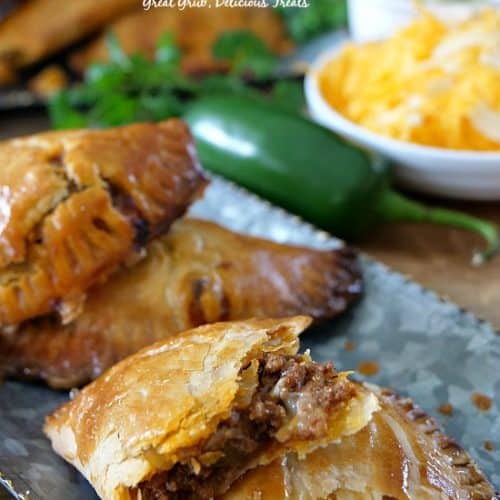 Three empanadas on a plate.