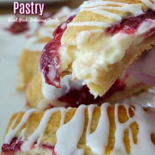 Fruity pastry ring slices in a white plate.